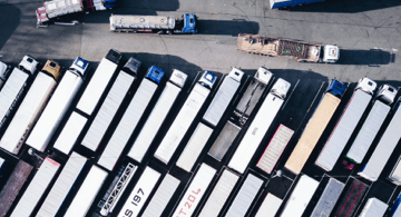 trucks and trailers in a parking lot